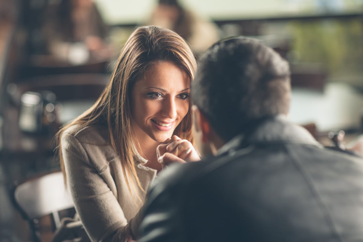 Woman gazes into eyes of man during conversation