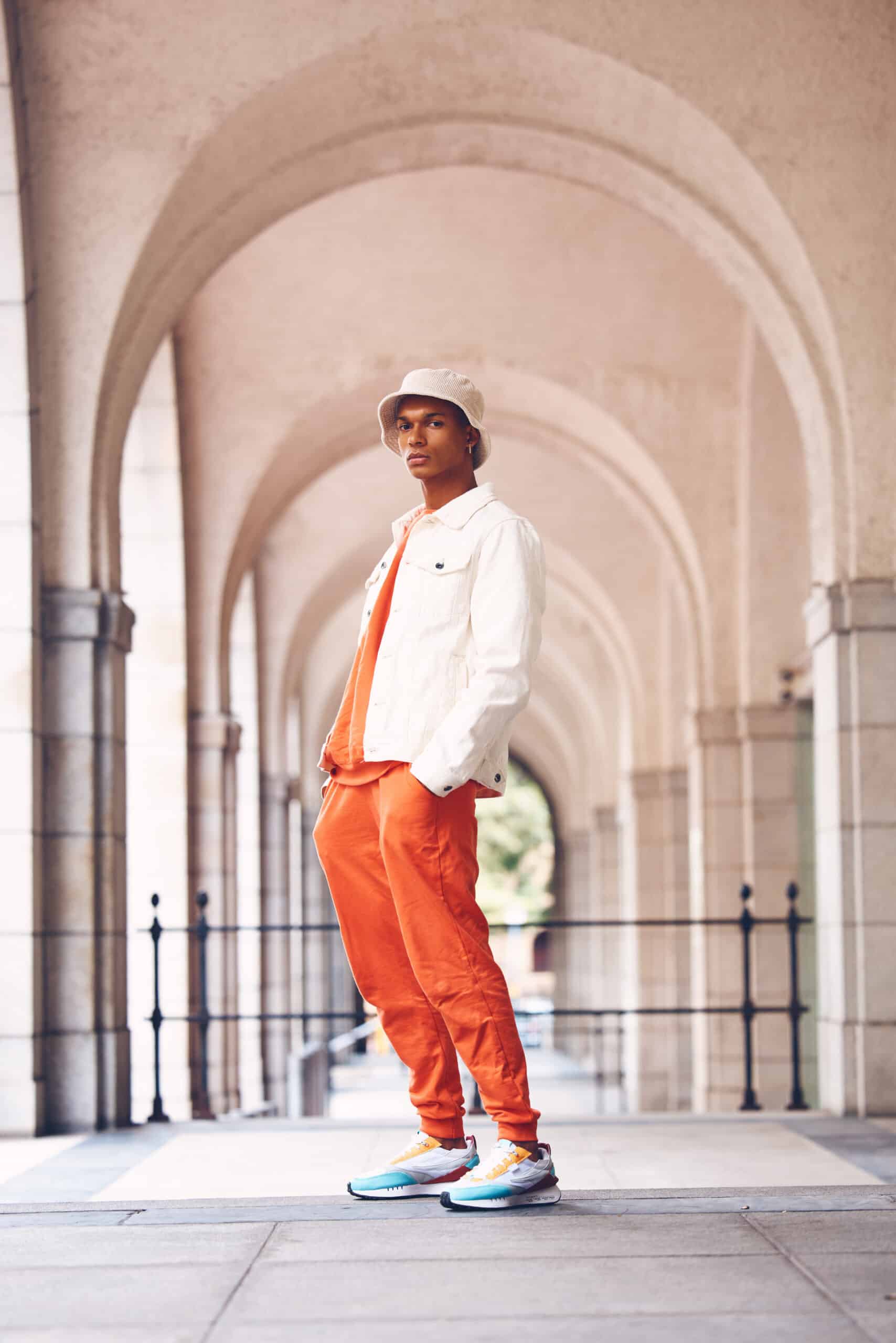 fashionable man dressed in bright orange outside