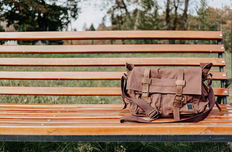 An image of a sturdy, rainproof bag on a wooden background, representing the tips for finding a suitable travel bag for adventures.