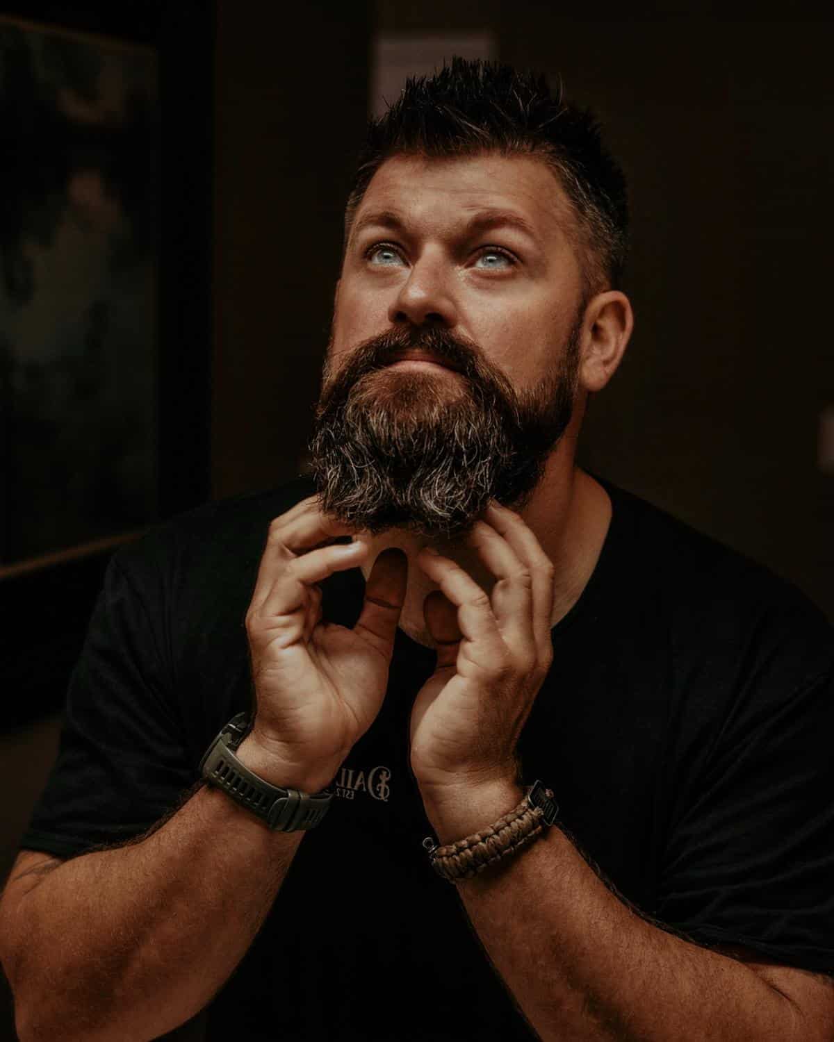 A man with a well-groomed beard, showcasing the importance of skin care in beard growth.