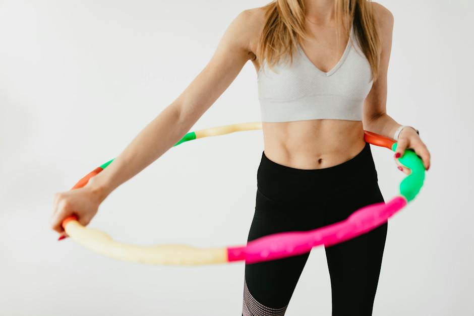 An image showing a tape measure wrapped around a slim waist, illustrating the concept of belly fat loss.